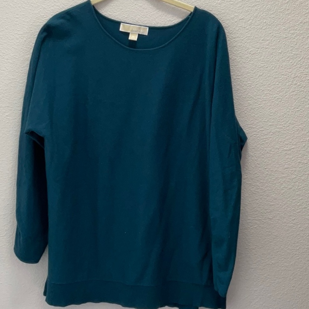 Michael Kors is a well known designer of fine apparel. This sweater is a size XL
